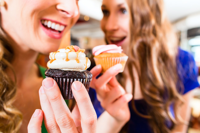 satisfied customers having cupcakes