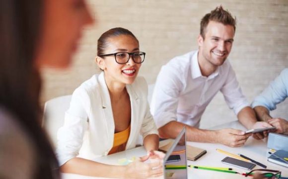Confident business partners interacting at meeting