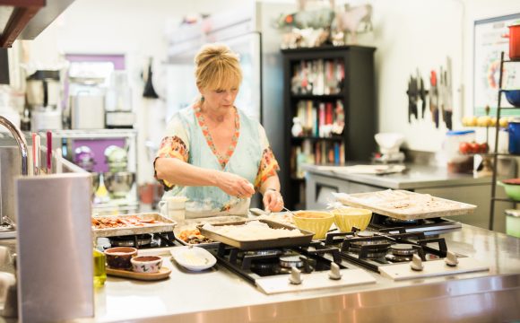 Sibby cooking at Onion Creek Kitchens