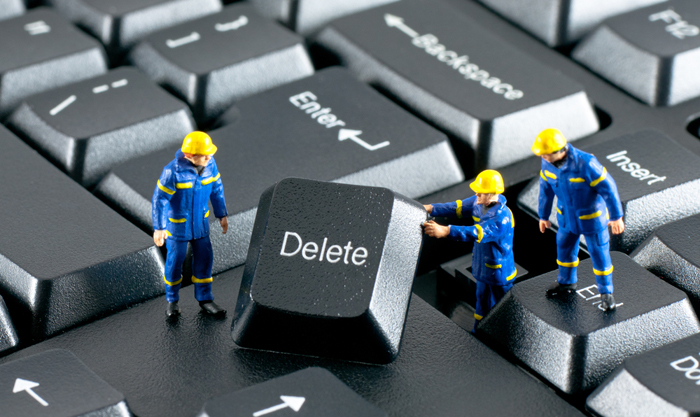 Team of construction workers working on a computer keyboard