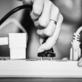 woman plugging in a power cord
