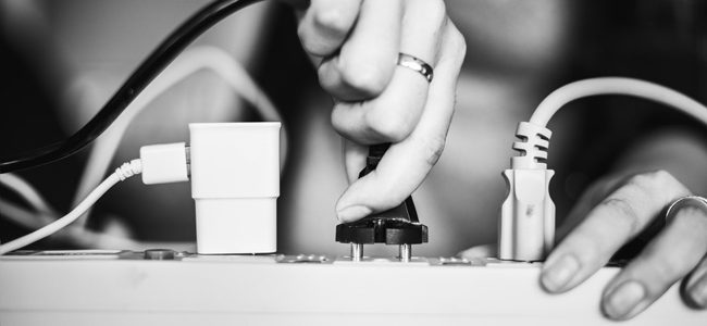 woman plugging in a power cord