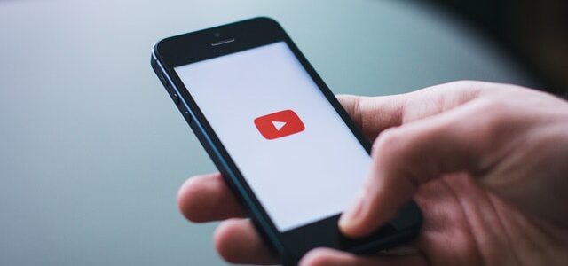 YouTube logo on a smartphone