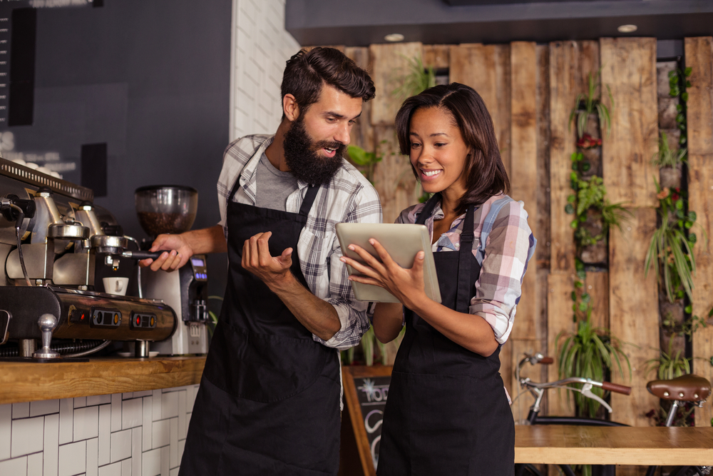 Restaurant and cafe managers working on website